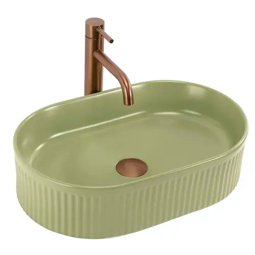 Chiuvetă de blat Vanda 50 cm Pistachio Matt din ceramică sanitară, finisaj verde mat, formă ovală cu suprafață exterioară striată.